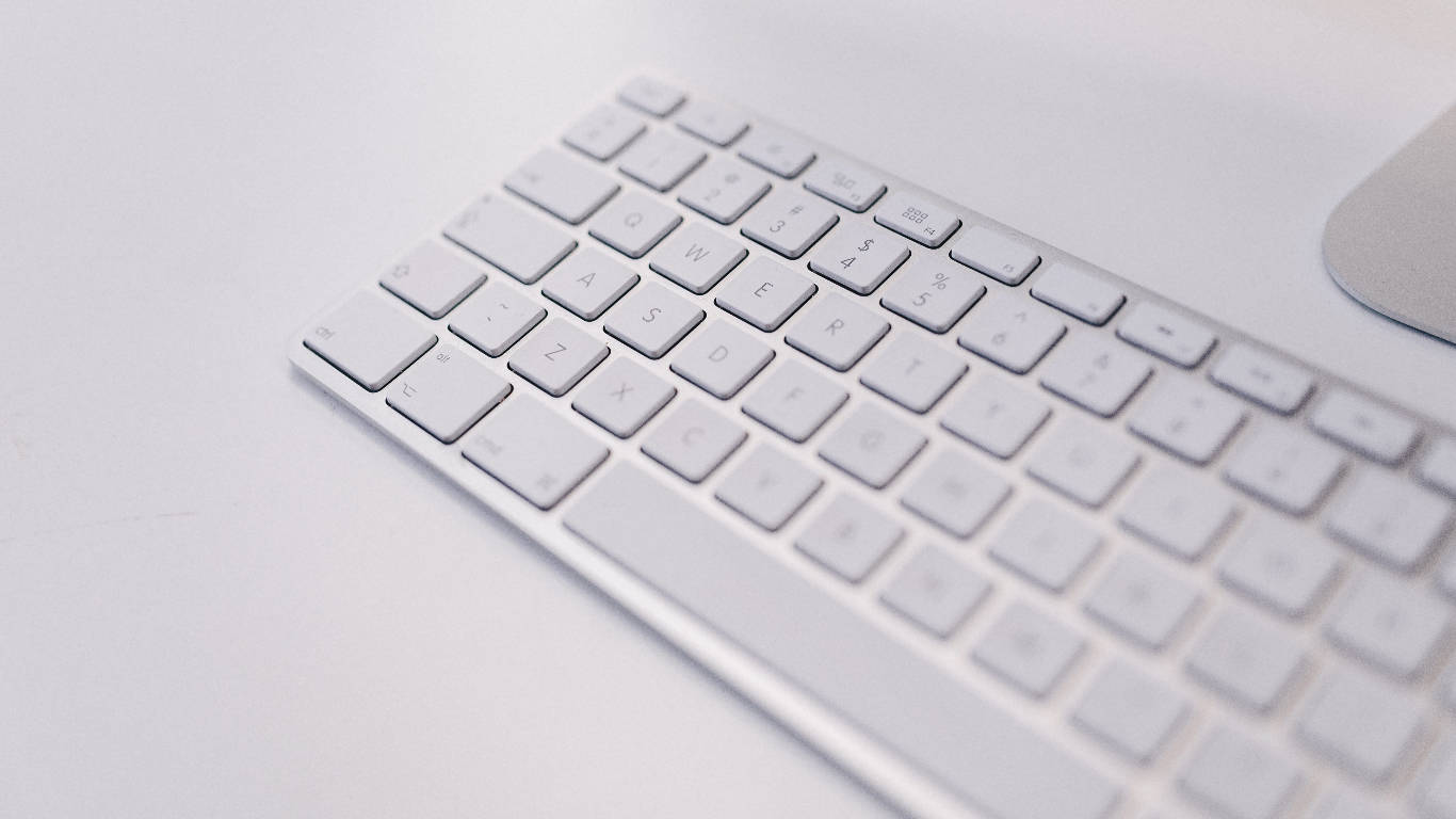 Sleek White Wireless Mac Keyboard Wallpaper