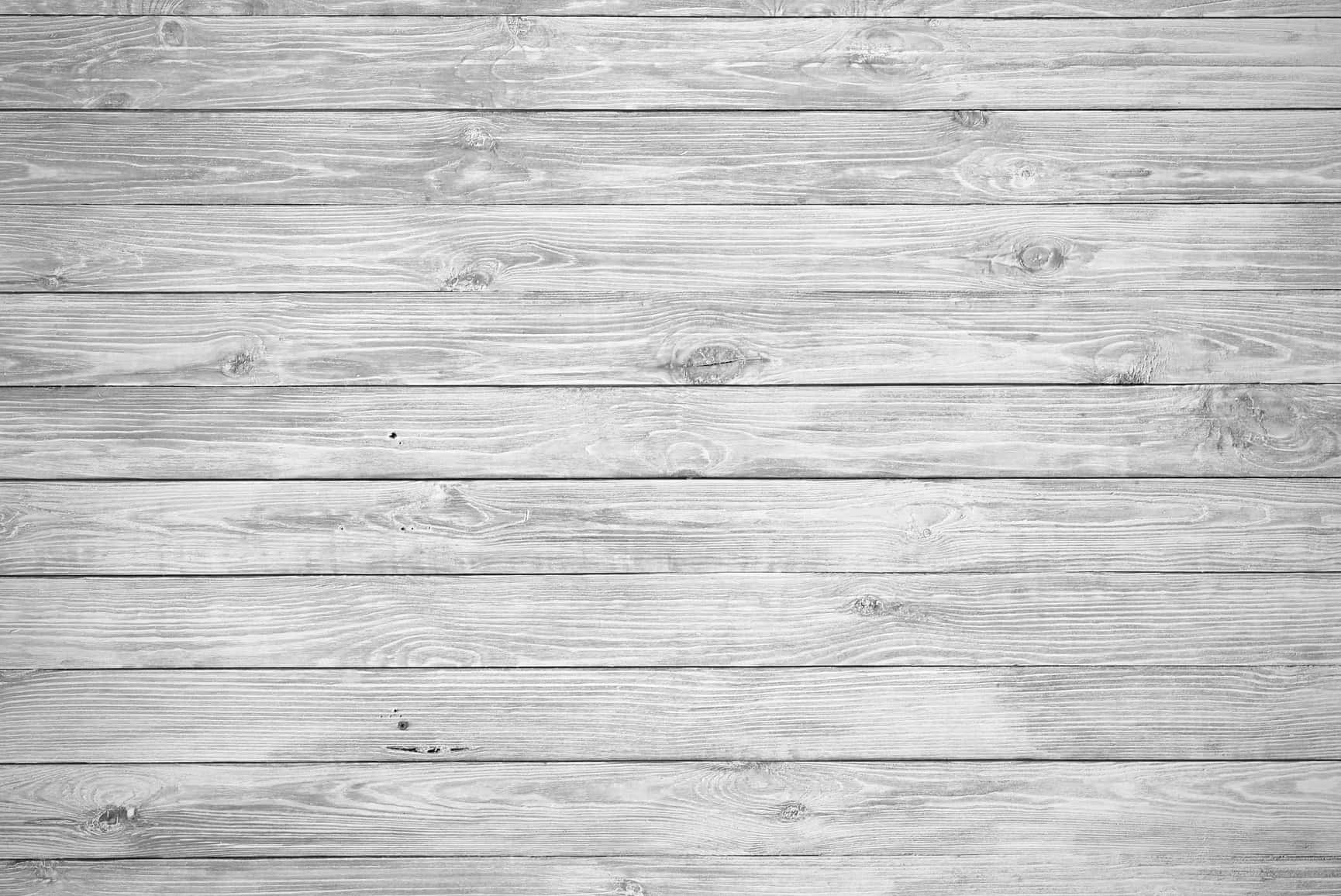 Små grå planker med hvidt træbaggrund