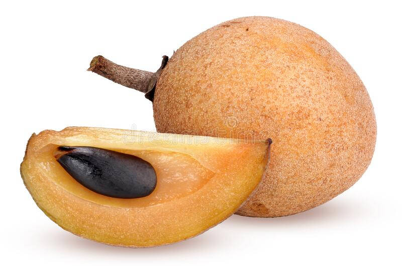 Whole and Sliced Sapodilla Fruit on a Wooden Table Wallpaper