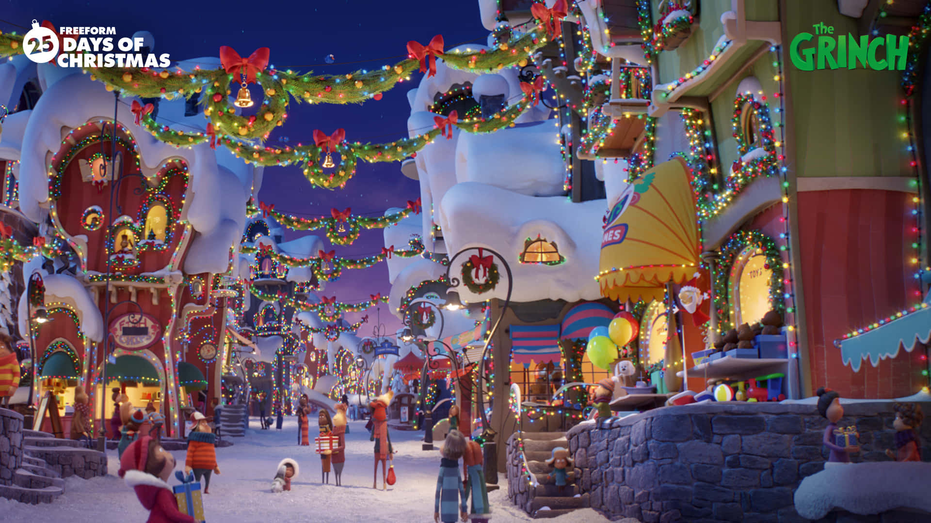 A Christmas Town With Many Decorations And Lights Wallpaper