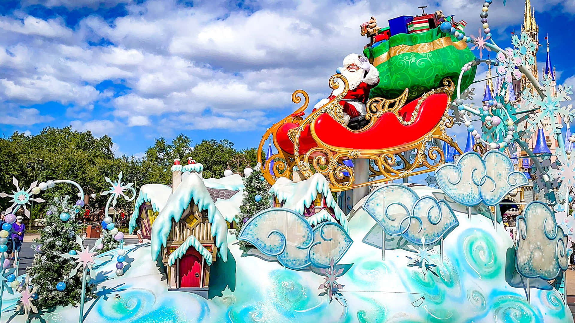 A Float Decorated With Santa Claus And Snowflakes