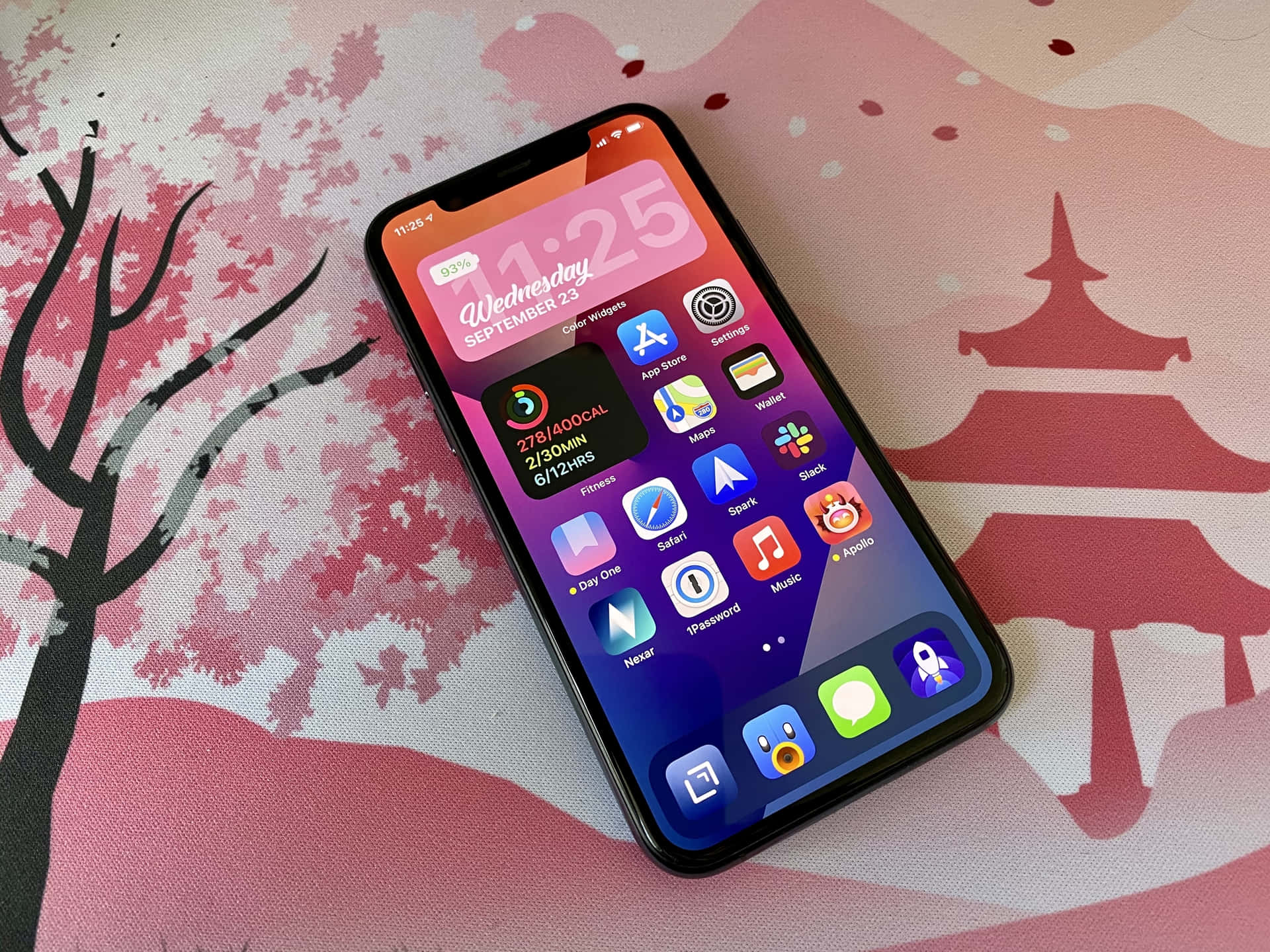 a phone with a pink background