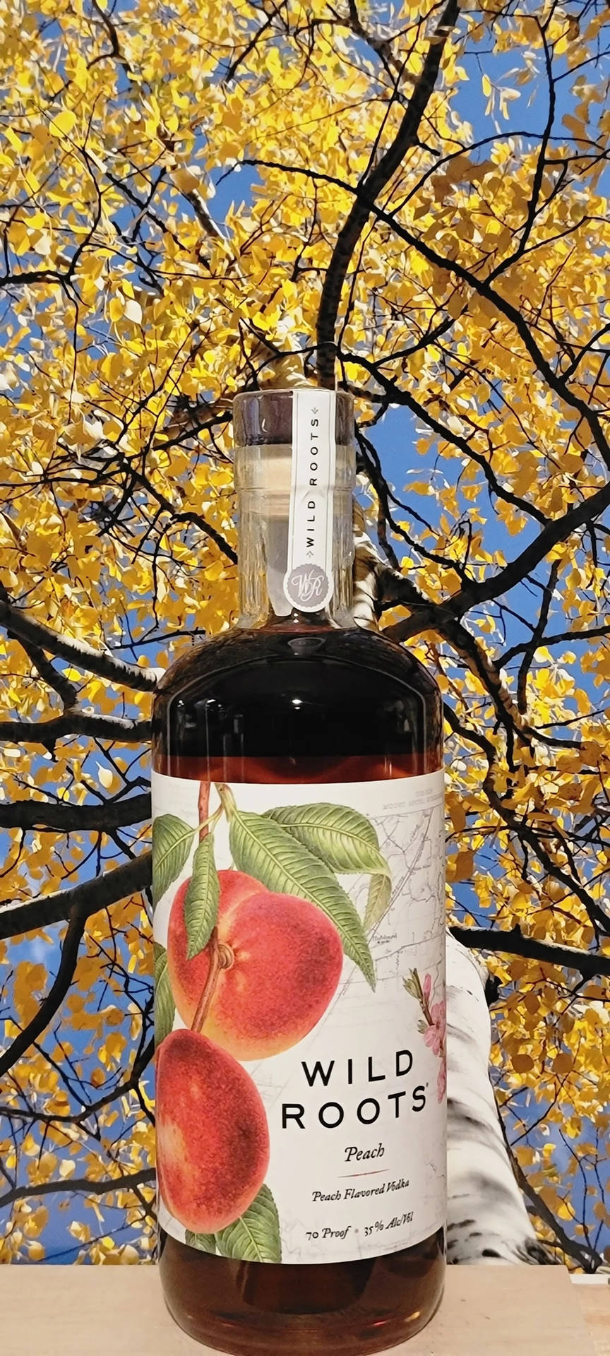 Wild Roots Peach Flavored Vodka Bottle Wallpaper