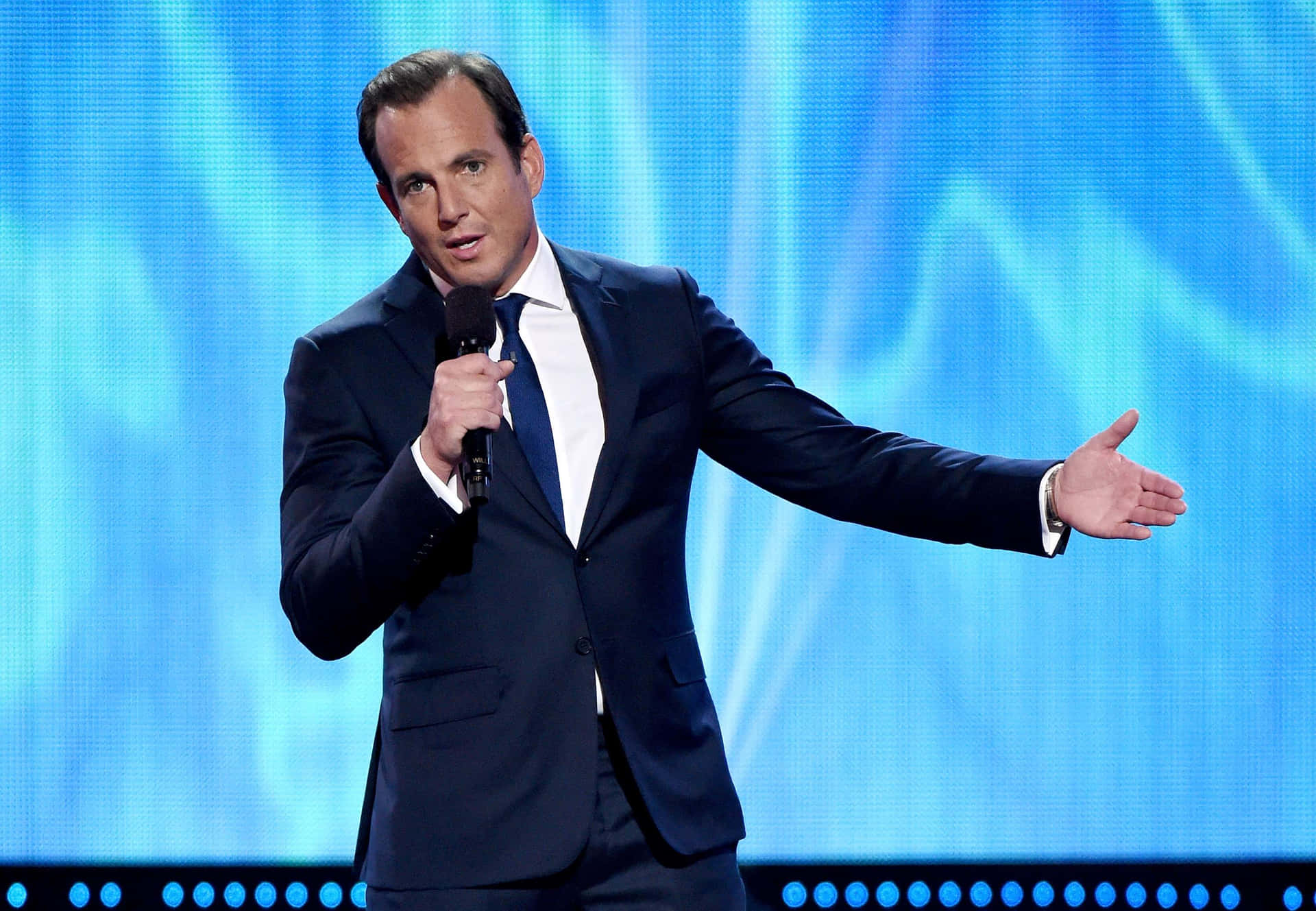 Will Arnett striking a pose in a stylish suit Wallpaper