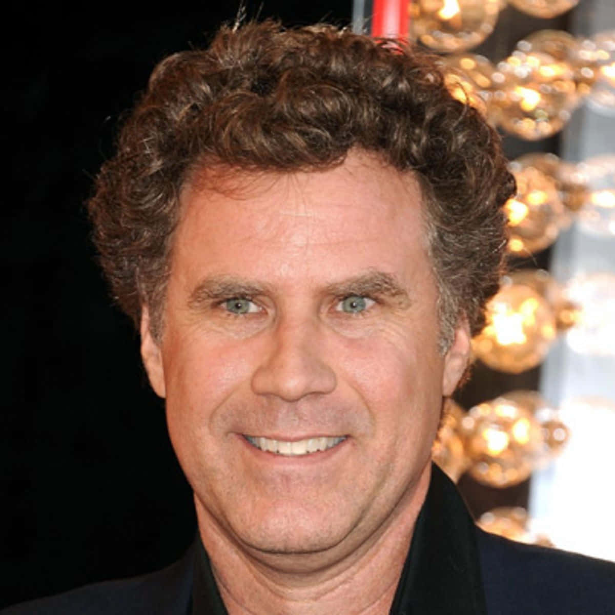 Comedic Genius Will Ferrell Smiling in a Suit and Tie Wallpaper
