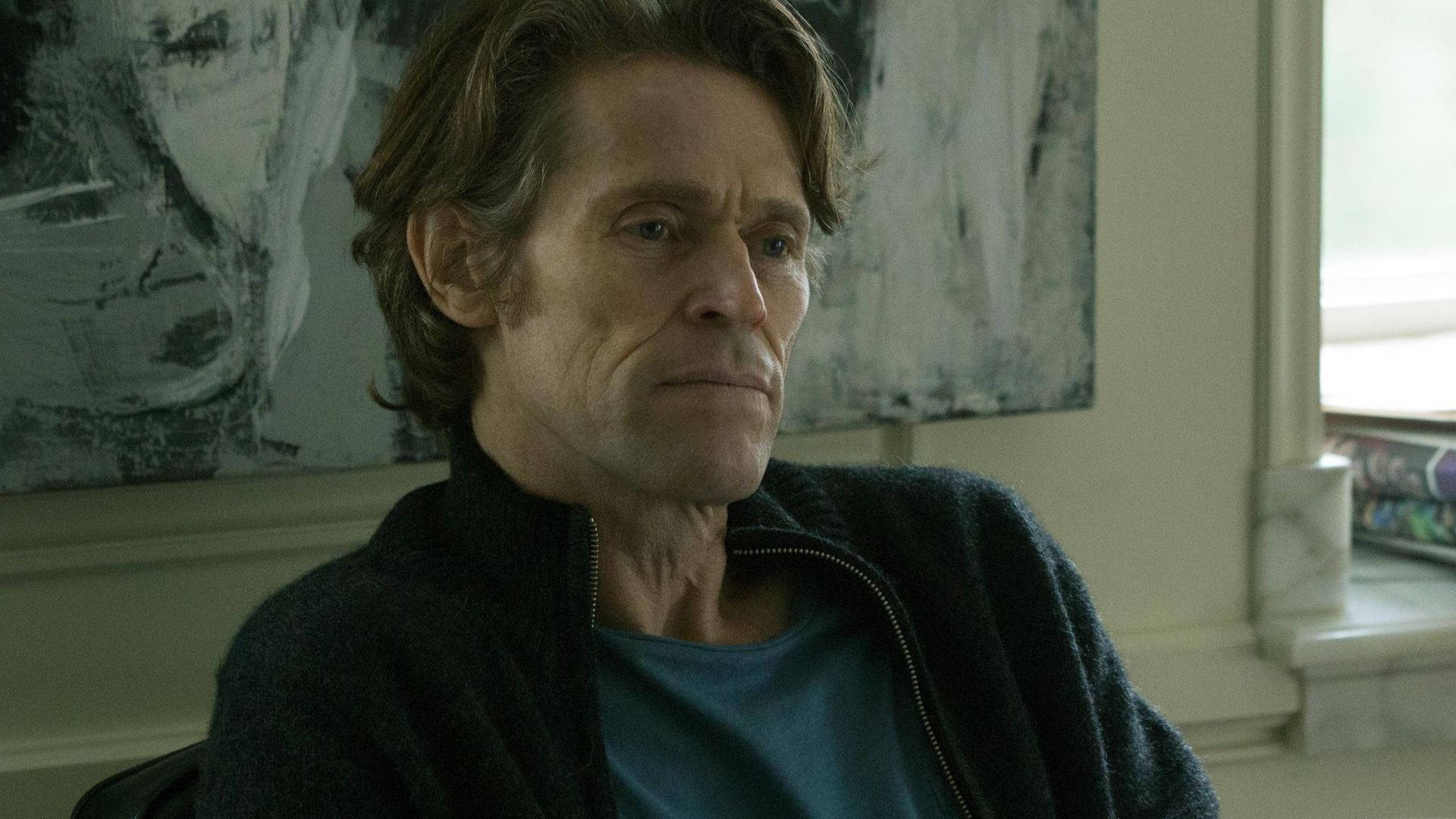 Acclaimed actor Willem Dafoe in a thought-provoking pose Wallpaper