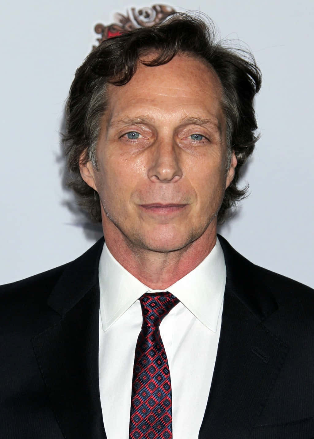 Actor William Fichtner in a contemplative pose Wallpaper