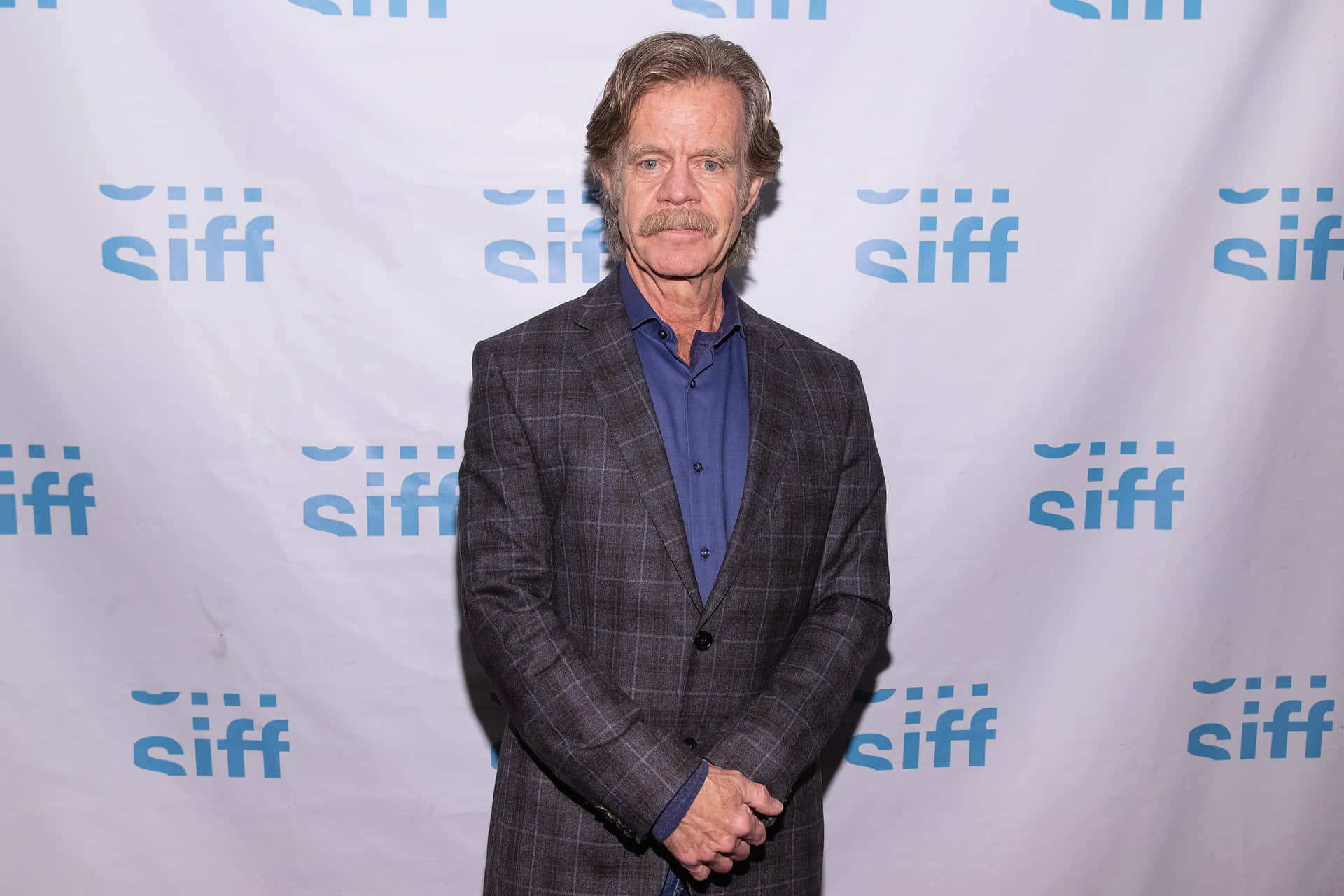 William H. Macy: Talented Actor in a Thoughtful Pose Wallpaper