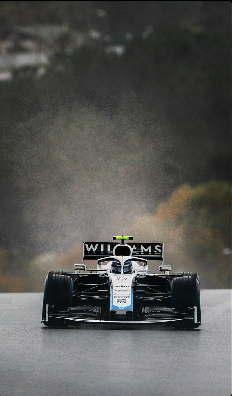 Williams Racing Car Driving From Forest Wallpaper