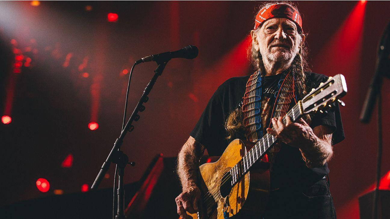 Willie Nelson On A Concert Performance Wallpaper