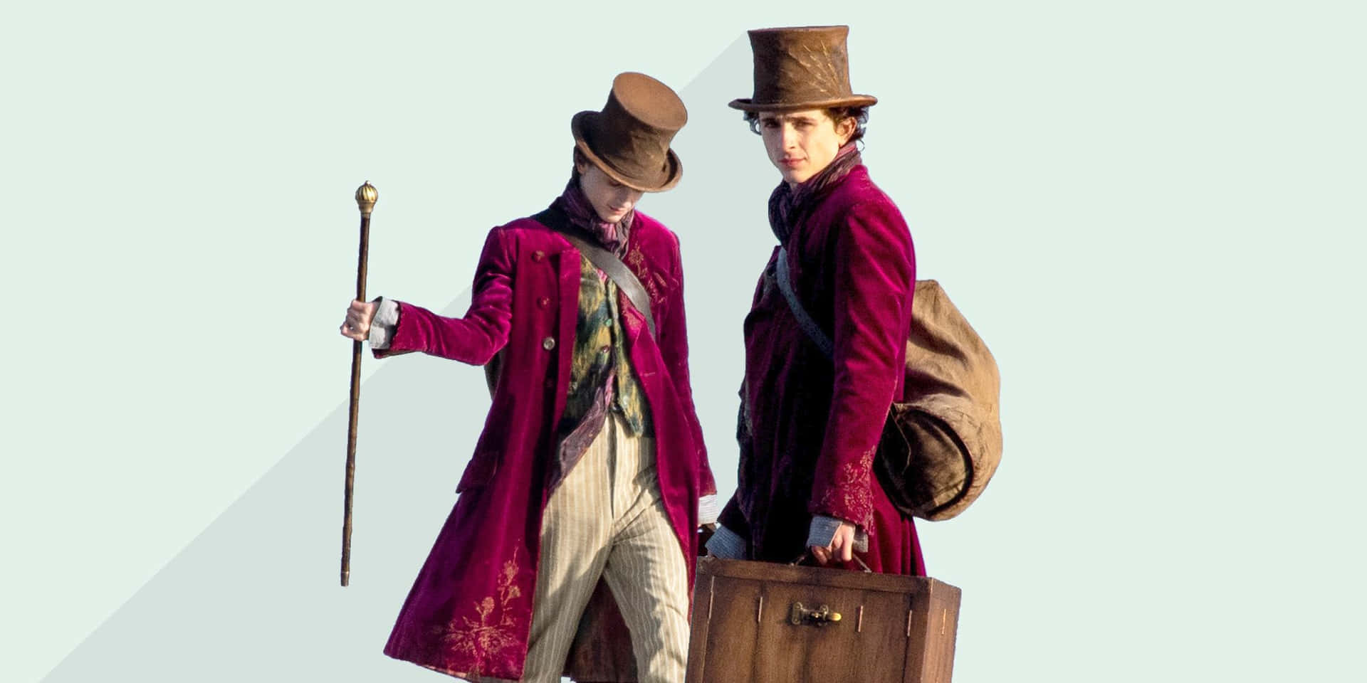 Two Men In Red Coats With Luggage