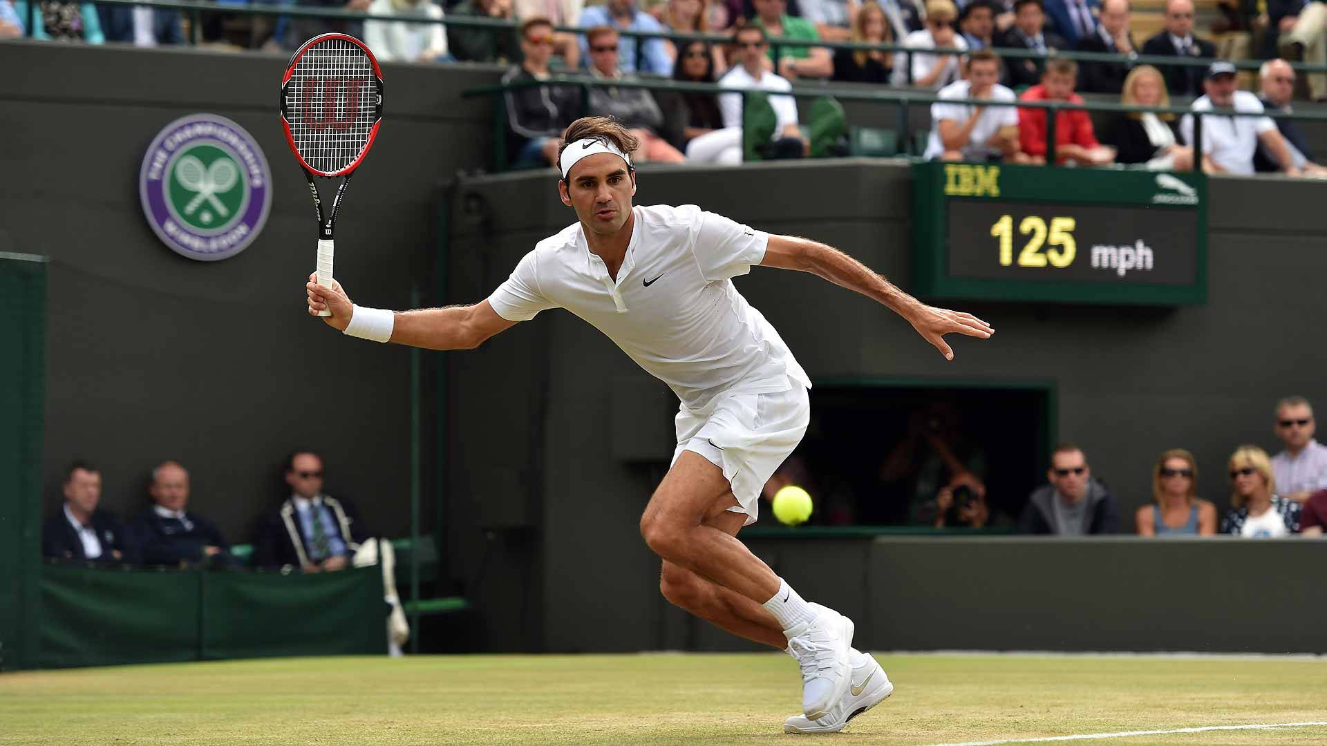 Caption: Roger Federer in Action at the Iconic Wimbledon Court Wallpaper