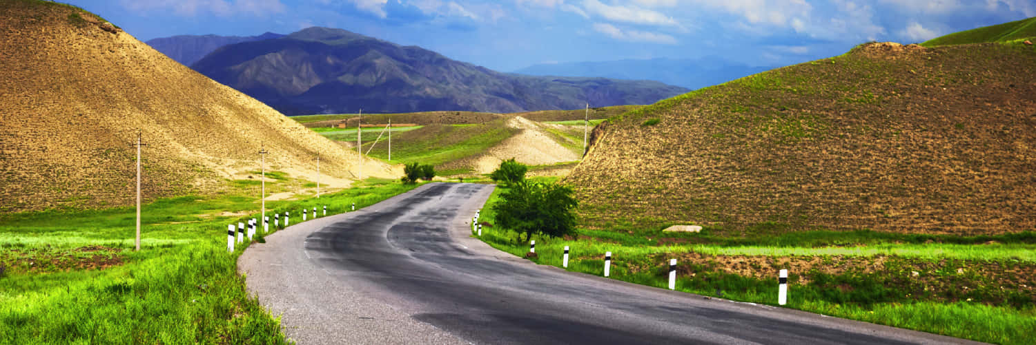 Winding Hillside Roads In Osh Wallpaper