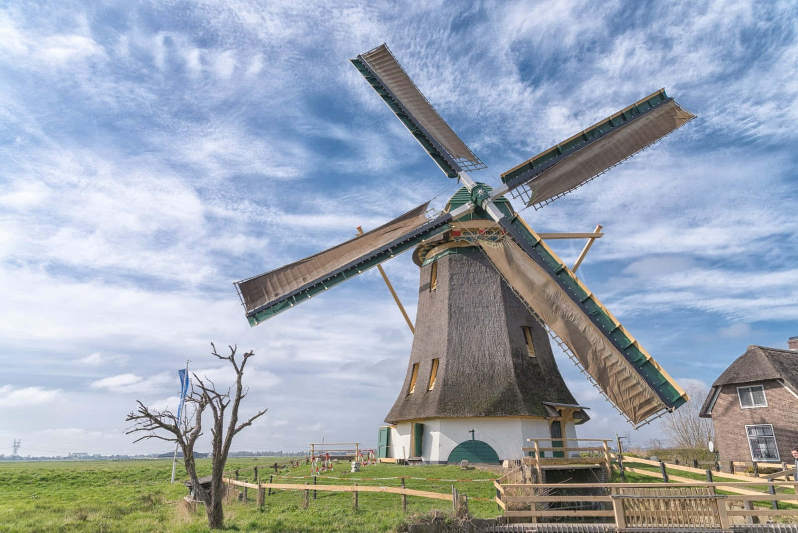 A Windmill In The Middle Of A Field