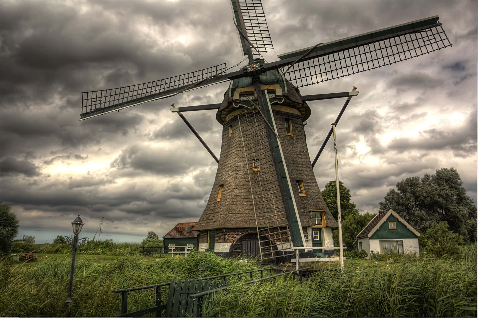 A breathtaking view of a windmill in the Netherlands countryside