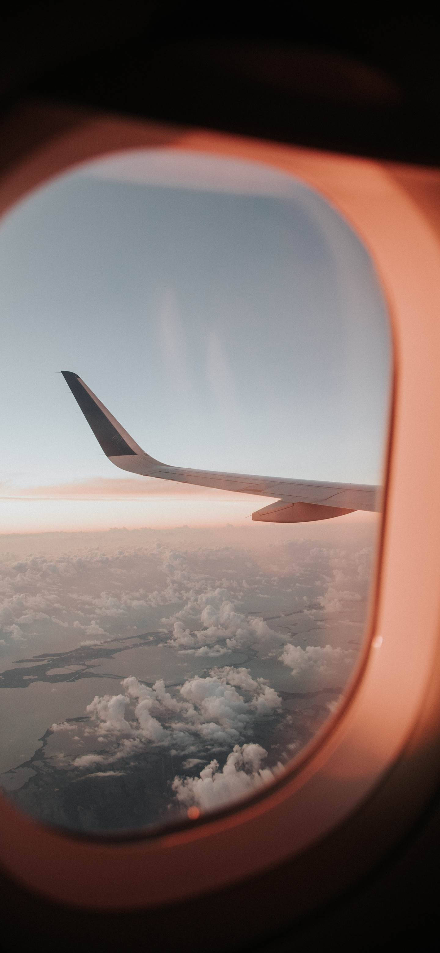 Window View Of A Flying Airplane Android Background