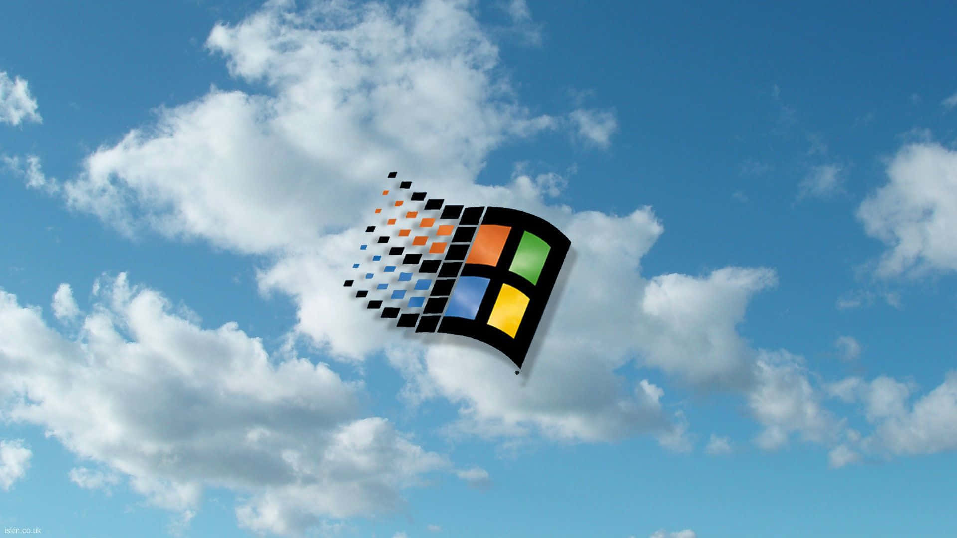 A Blue Sky With Clouds And A Windows Logo
