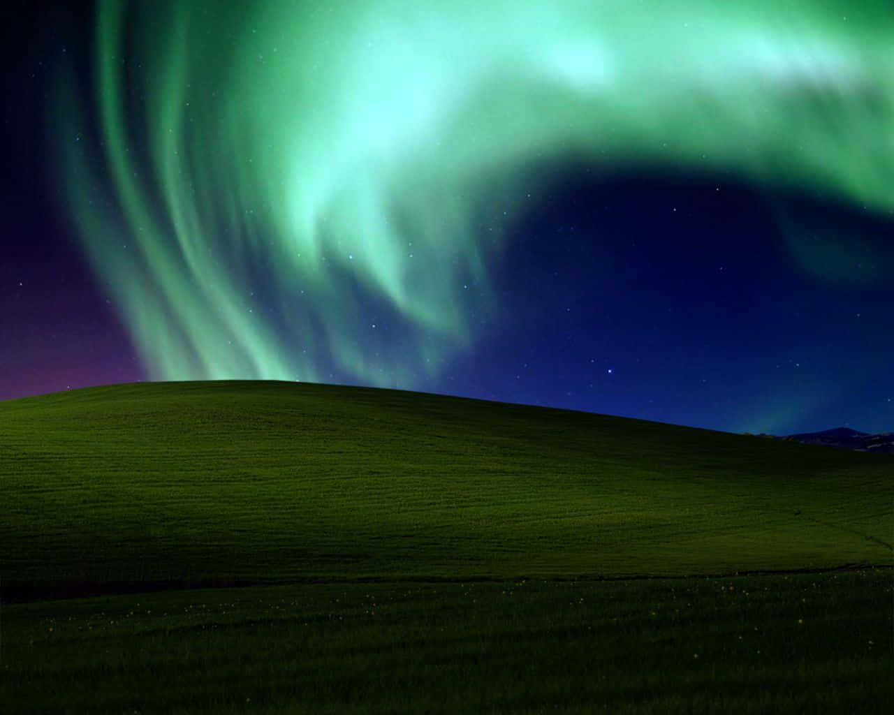 A Green Field With An Aurora Bore In The Sky