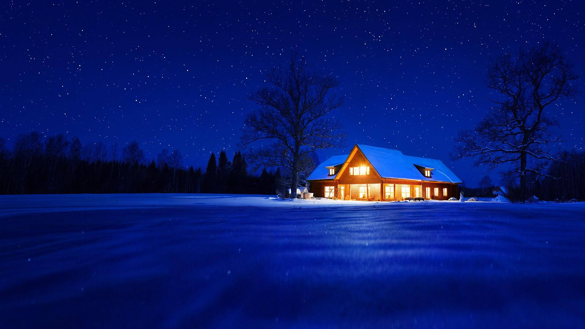 Fondode Pantalla De Windows: Cabaña Invernal En La Noche Estrellada. Fondo de pantalla