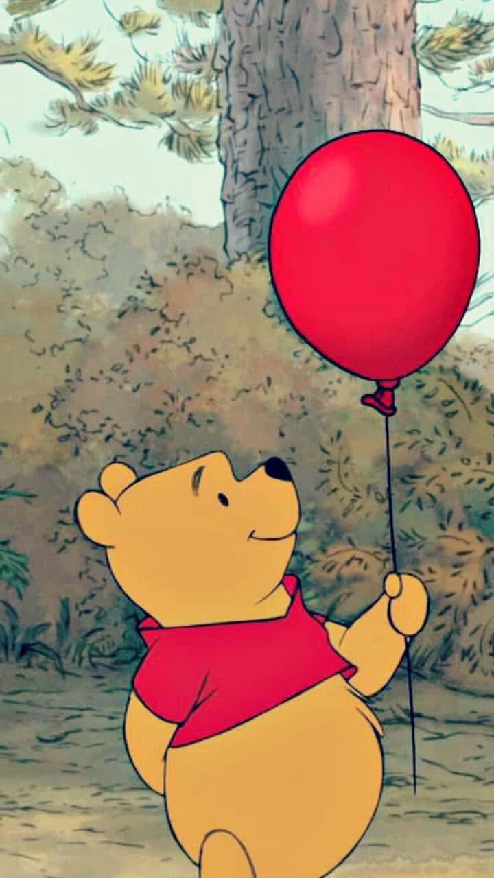 Estéticade Winnie The Pooh Con Un Globo Rojo. Fondo de pantalla