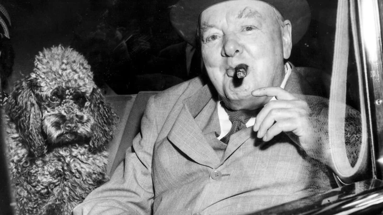 A Man In A Suit Smoking A Cigarette With A Dog