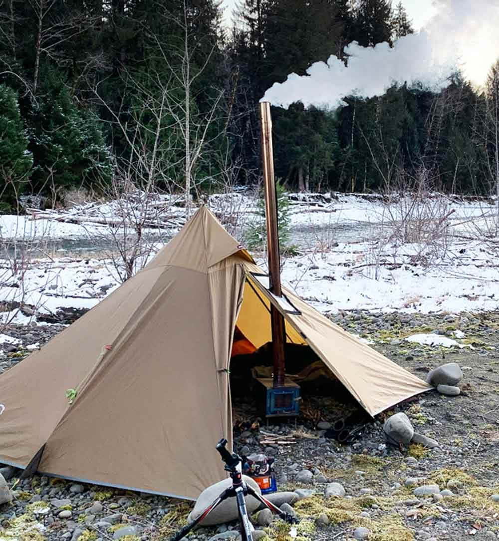 A Cozy Winter Camping Adventure Wallpaper