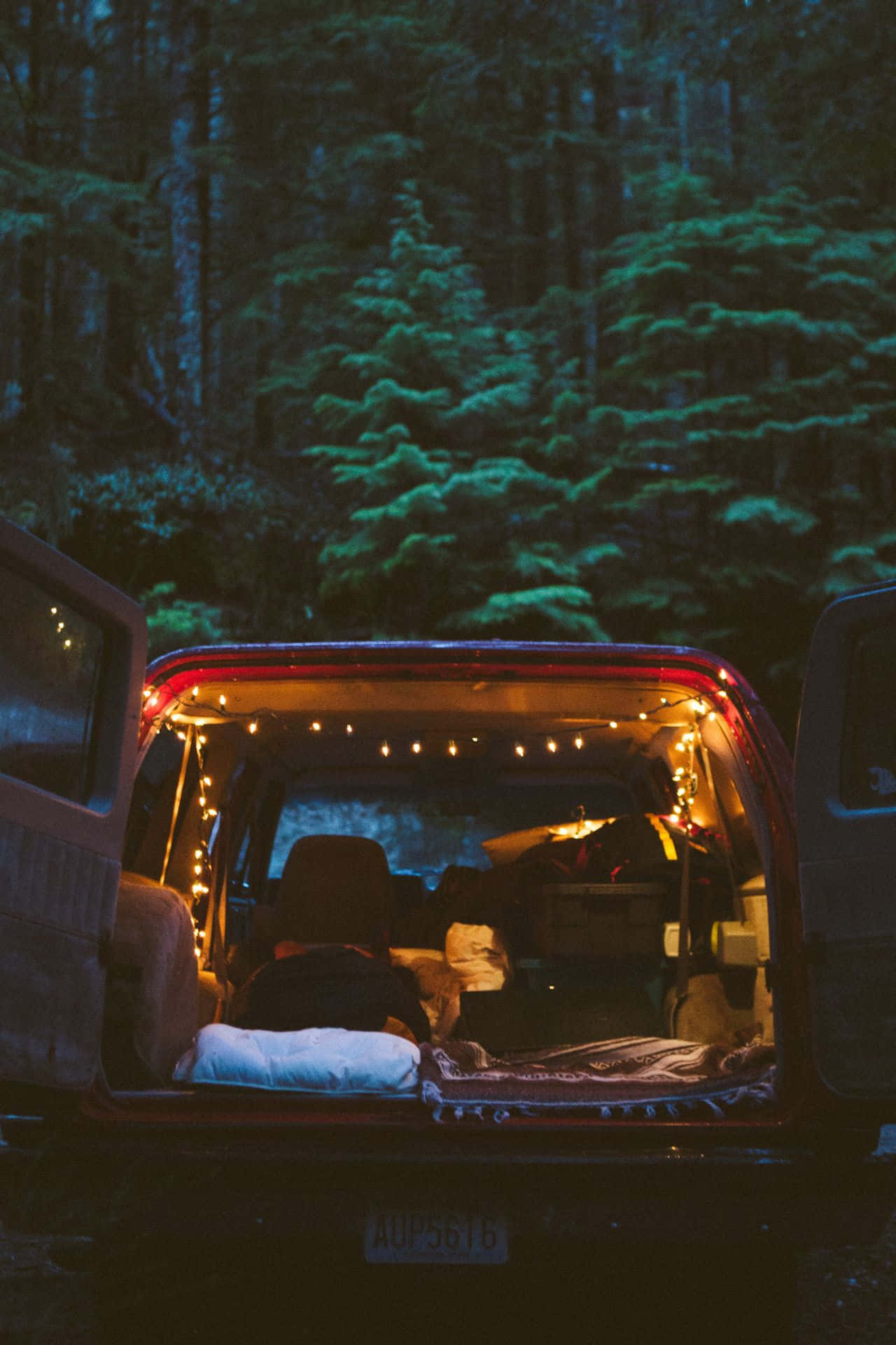 Caption: A cozy campsite in a snowy winter wonderland. Wallpaper