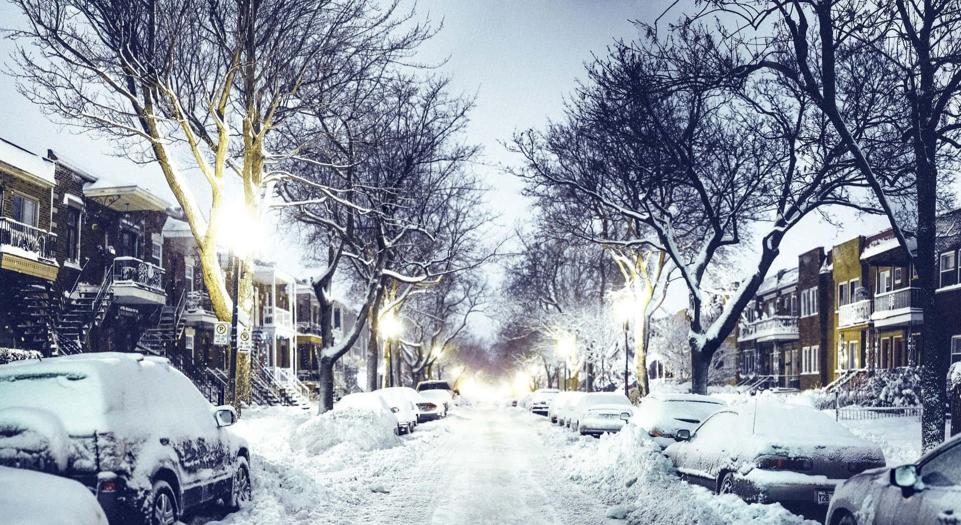 Winter Cityscape with Snowy Bridge and River Wallpaper