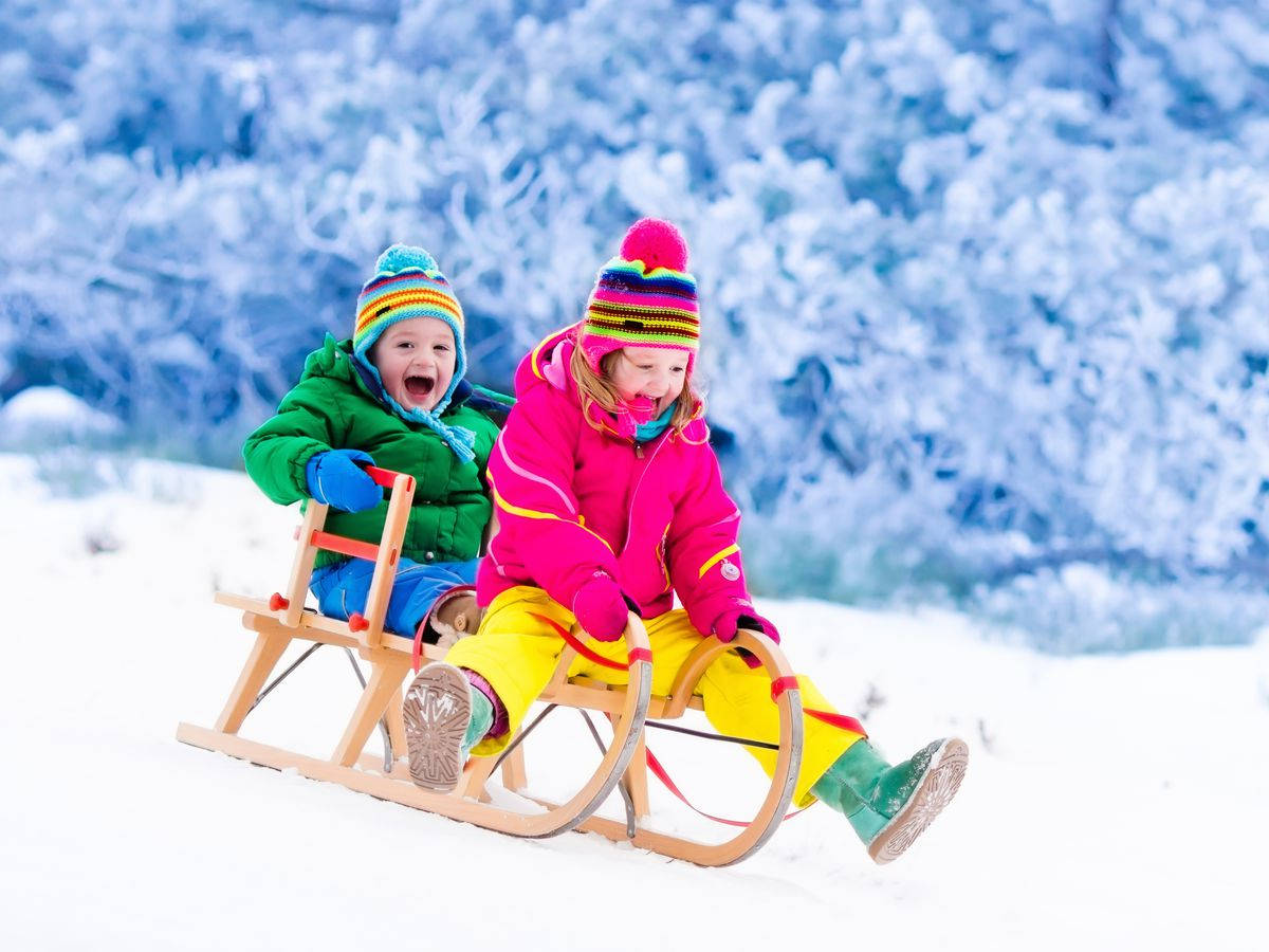 Winter Cute Kids Sledding Wallpaper