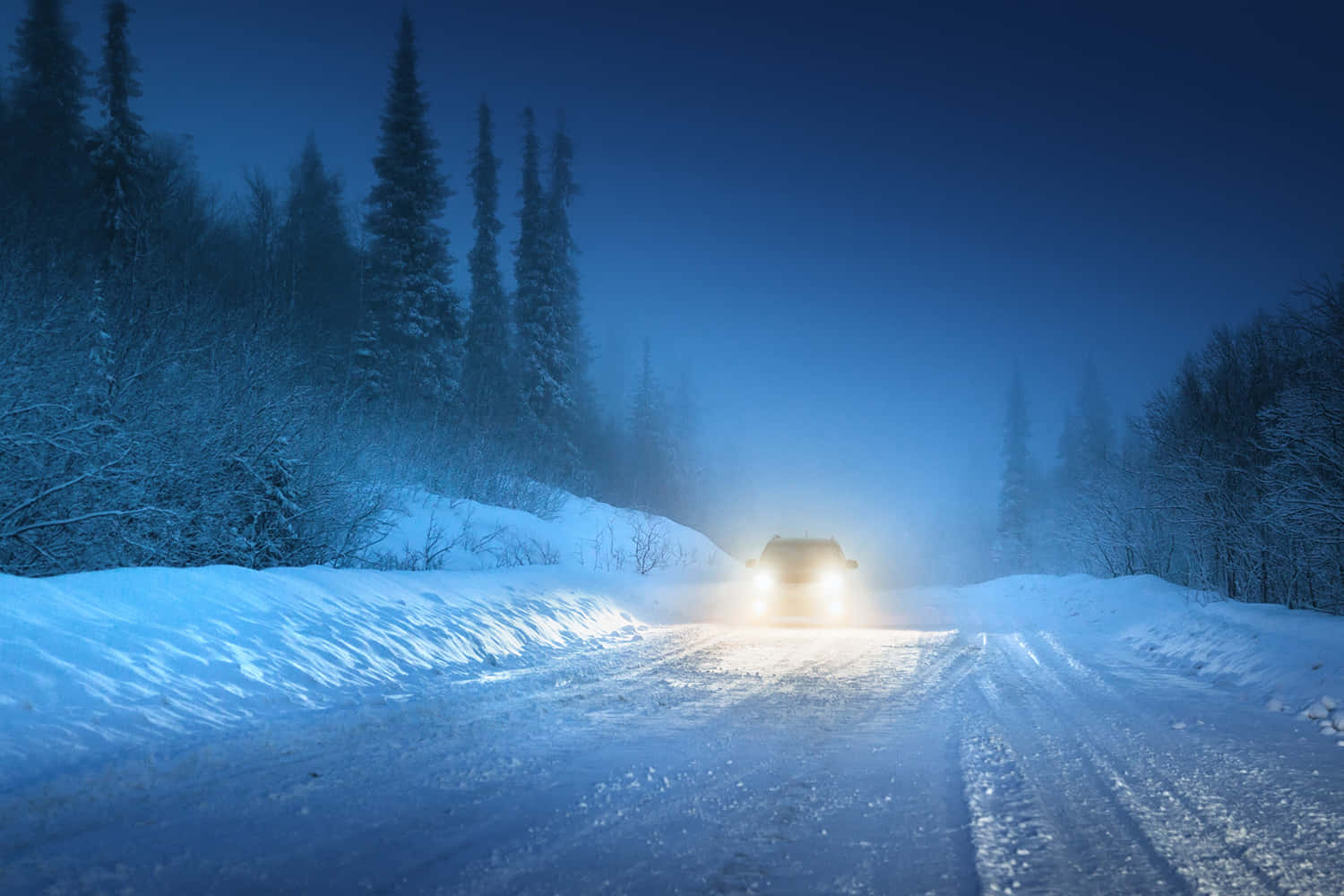 Safe Winter Driving on Snow-covered Road Wallpaper