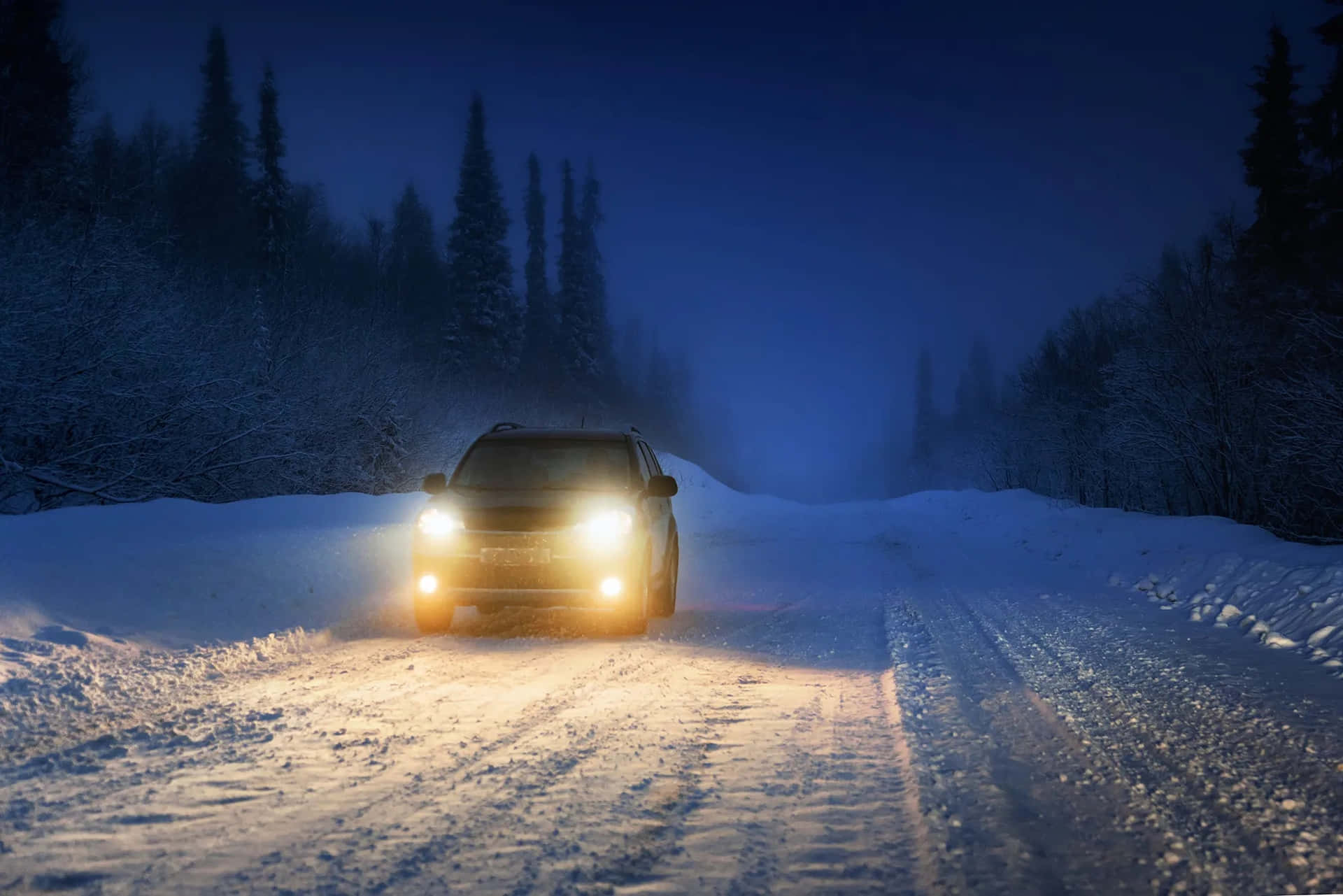 Navigating Snowy Roads on a Winter Day Wallpaper
