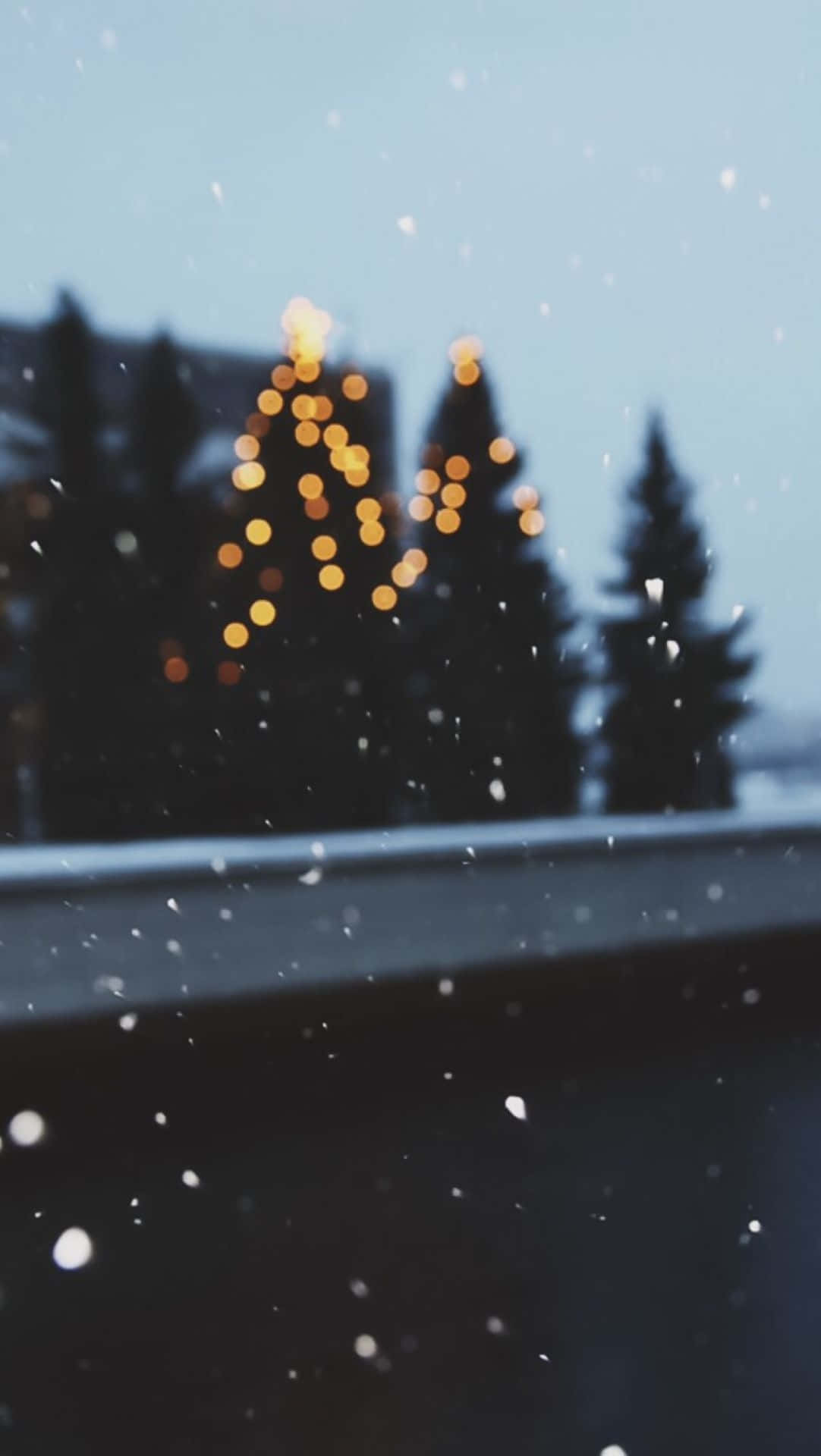 Winter_ Evening_ Snowfall_with_ Twinkling_ Lights.jpg Wallpaper