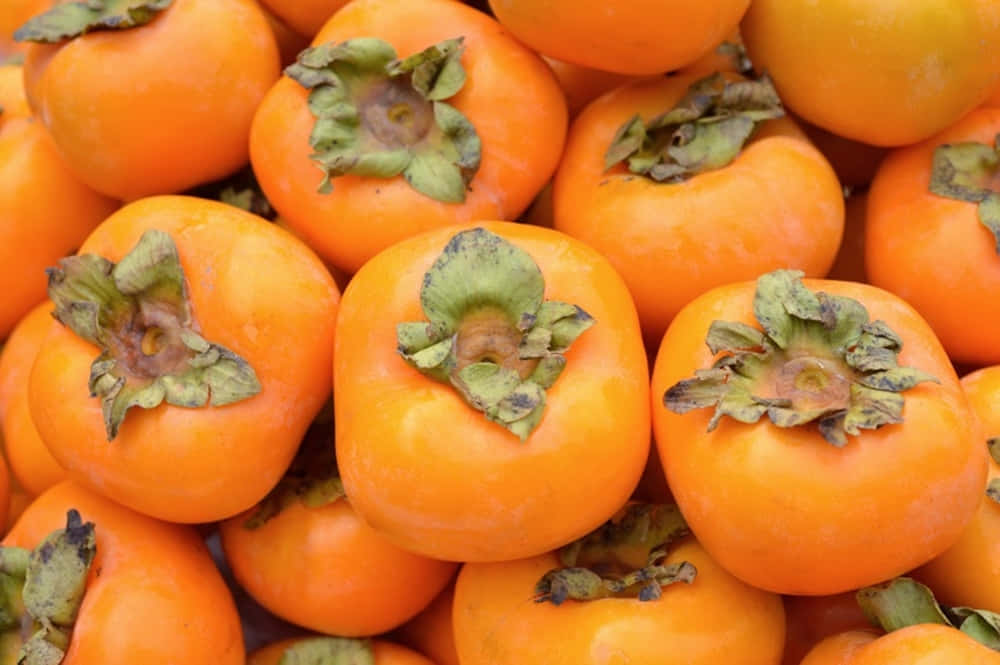 Fresh Winter Fruits on a Wood Surface Wallpaper