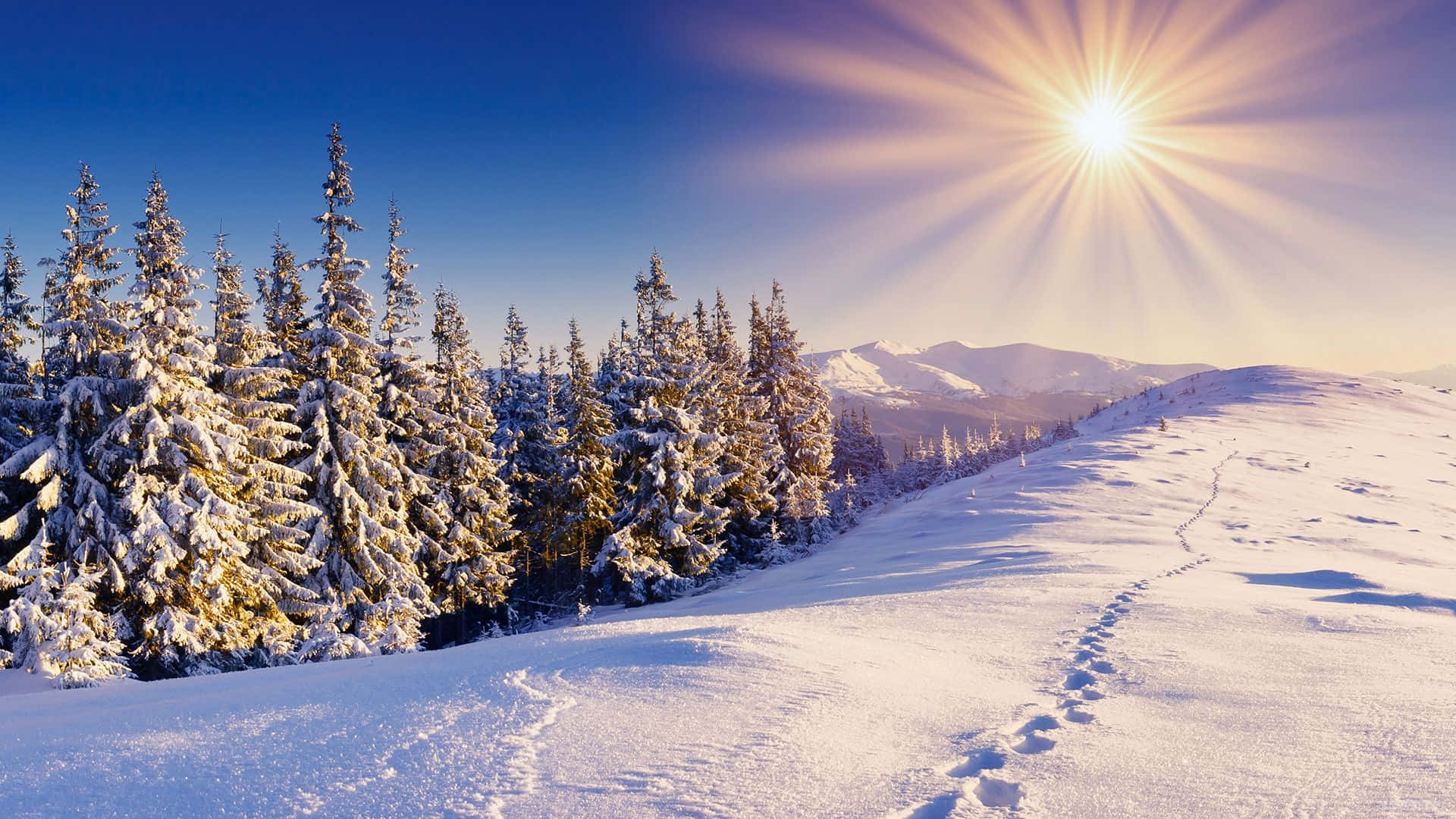 A Stunning View of a Snow-Covered Landscape Wallpaper