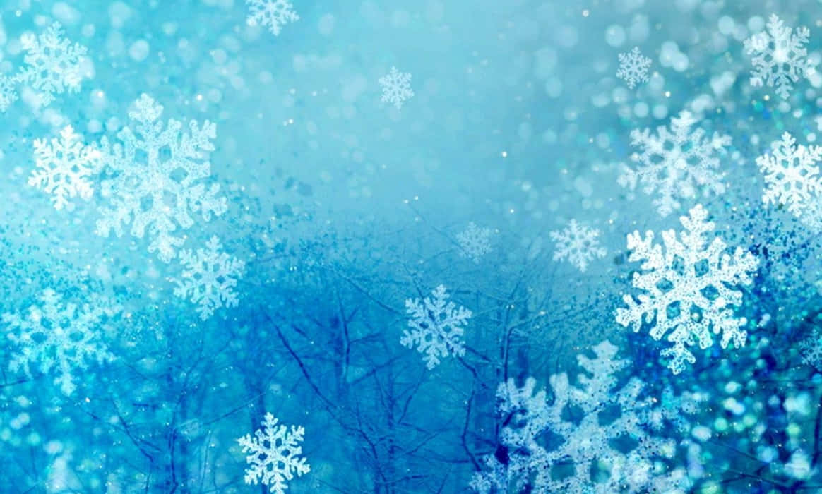 Winterurlaubdesktop Mit Weißen Schneeflocken Wallpaper