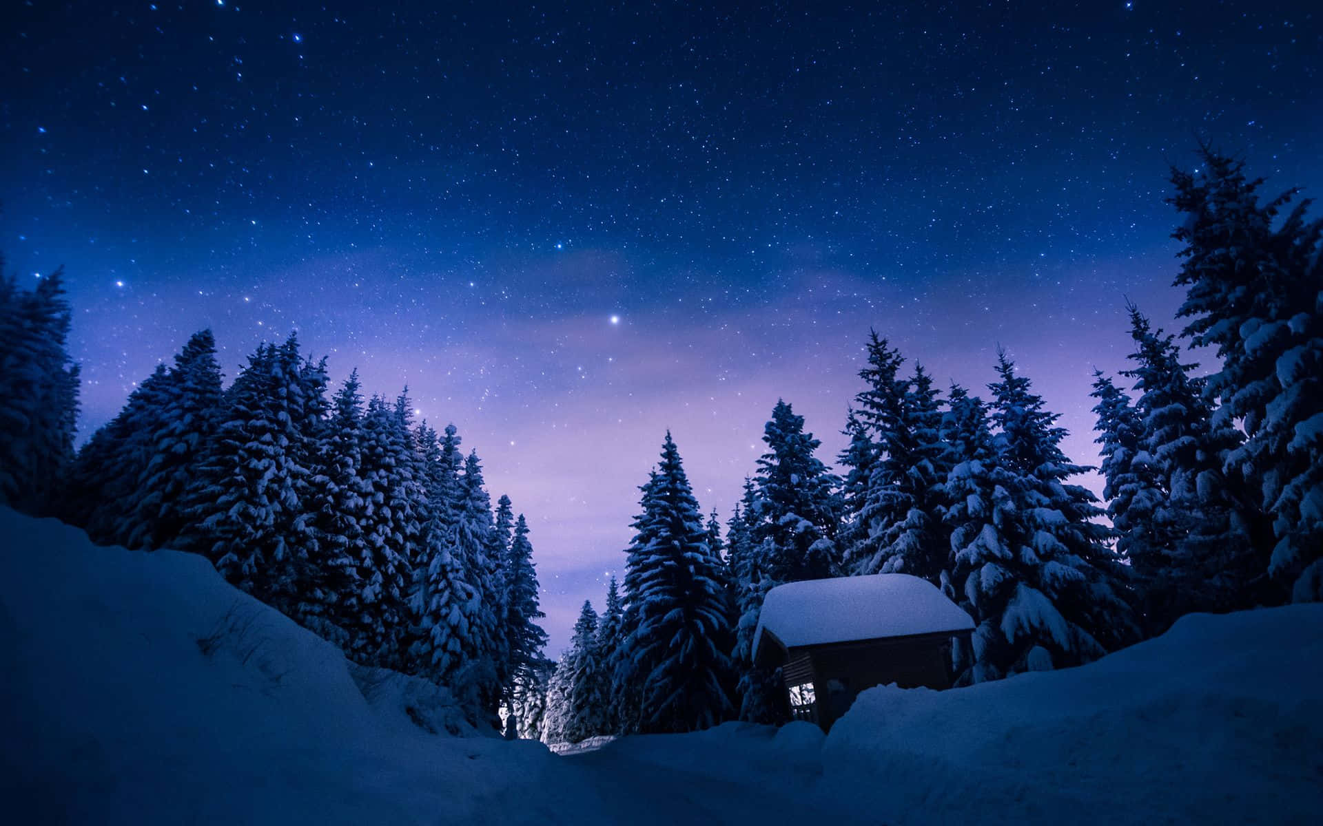 Winter Night Desktop With A Lonely Cabin Wallpaper