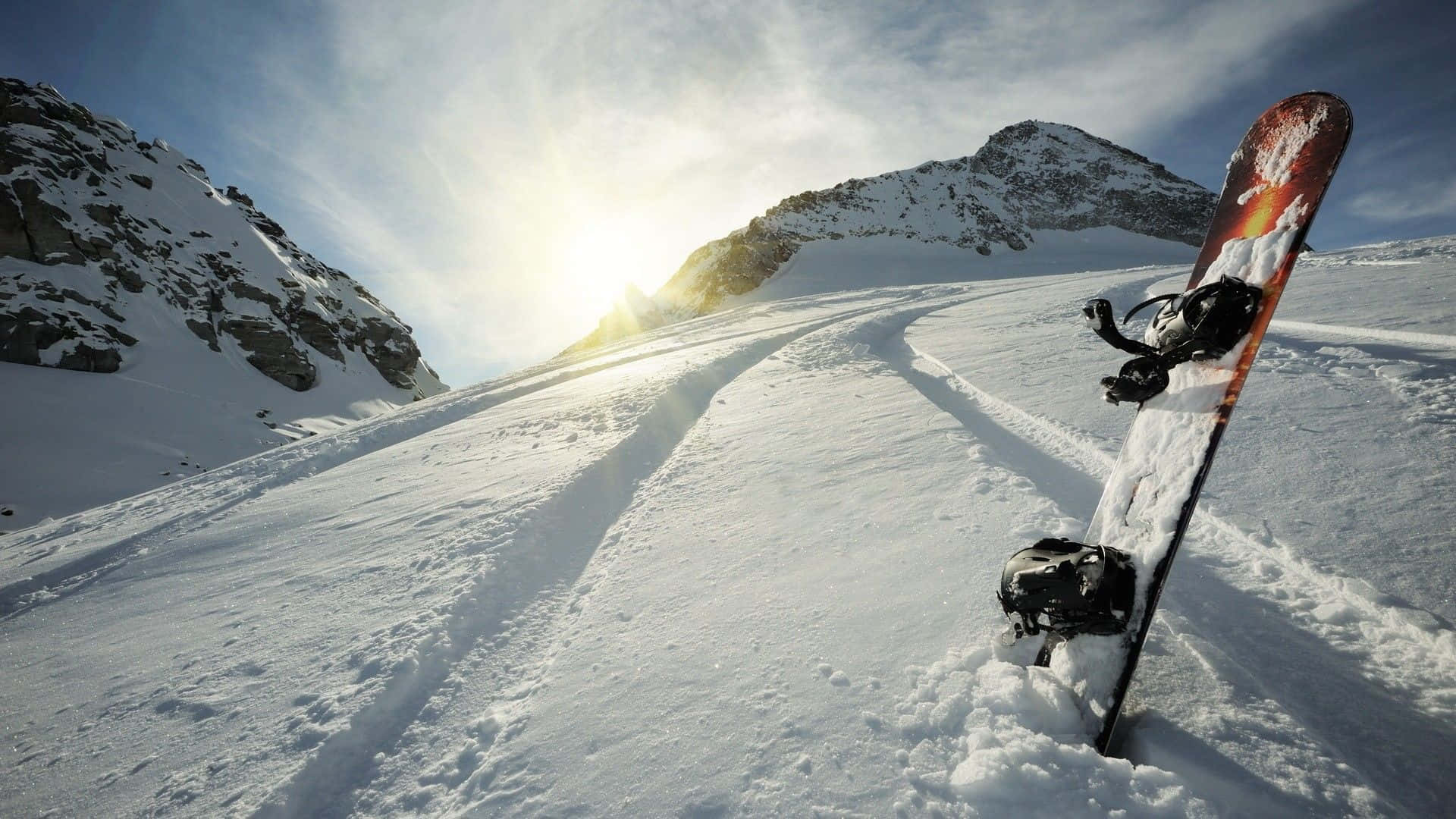 Thrilling Ski Adventure on Snowy Mountain Slope Wallpaper