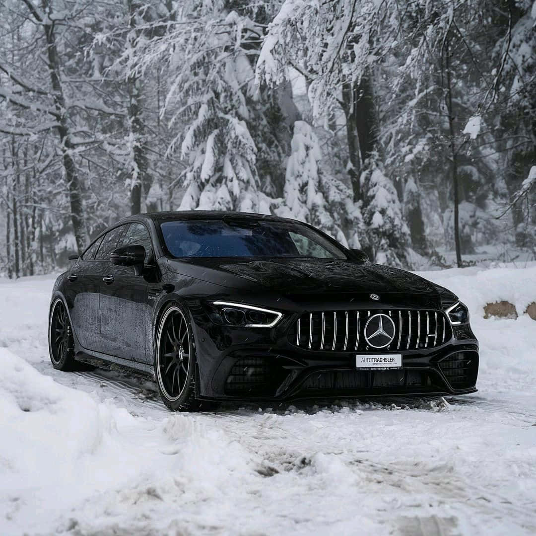 Quality Winter Tires on Snowy Road Wallpaper