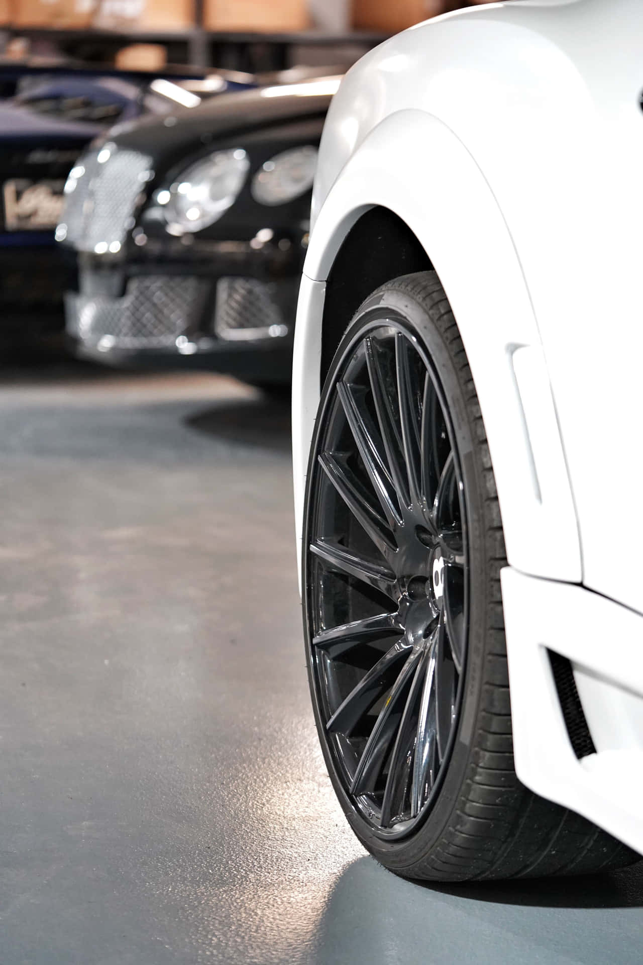 A set of winter tires on a snowy road against a scenic backdrop Wallpaper