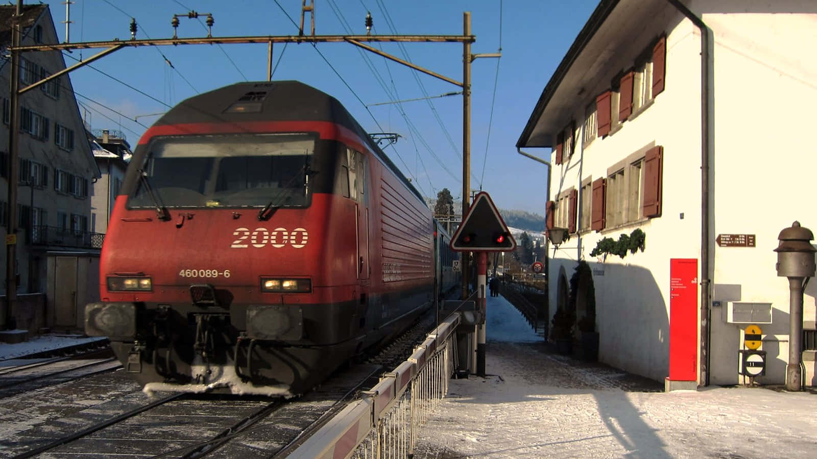Winter Train Passing Through Horgen Switzerland Wallpaper