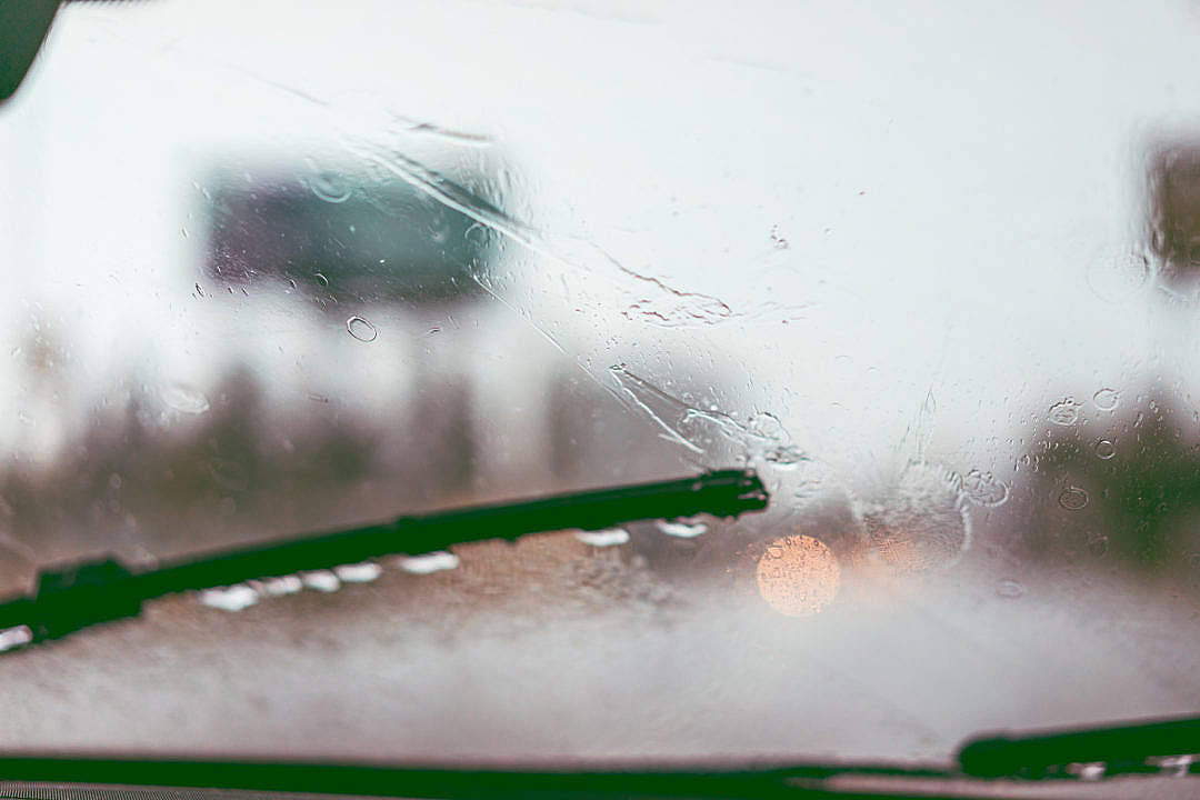 Wipers Cleaning A Windshield After Raining Wallpaper