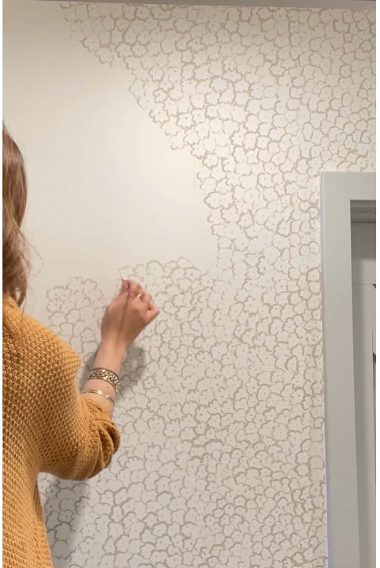 Woman Applying Wall Decal Wallpaper