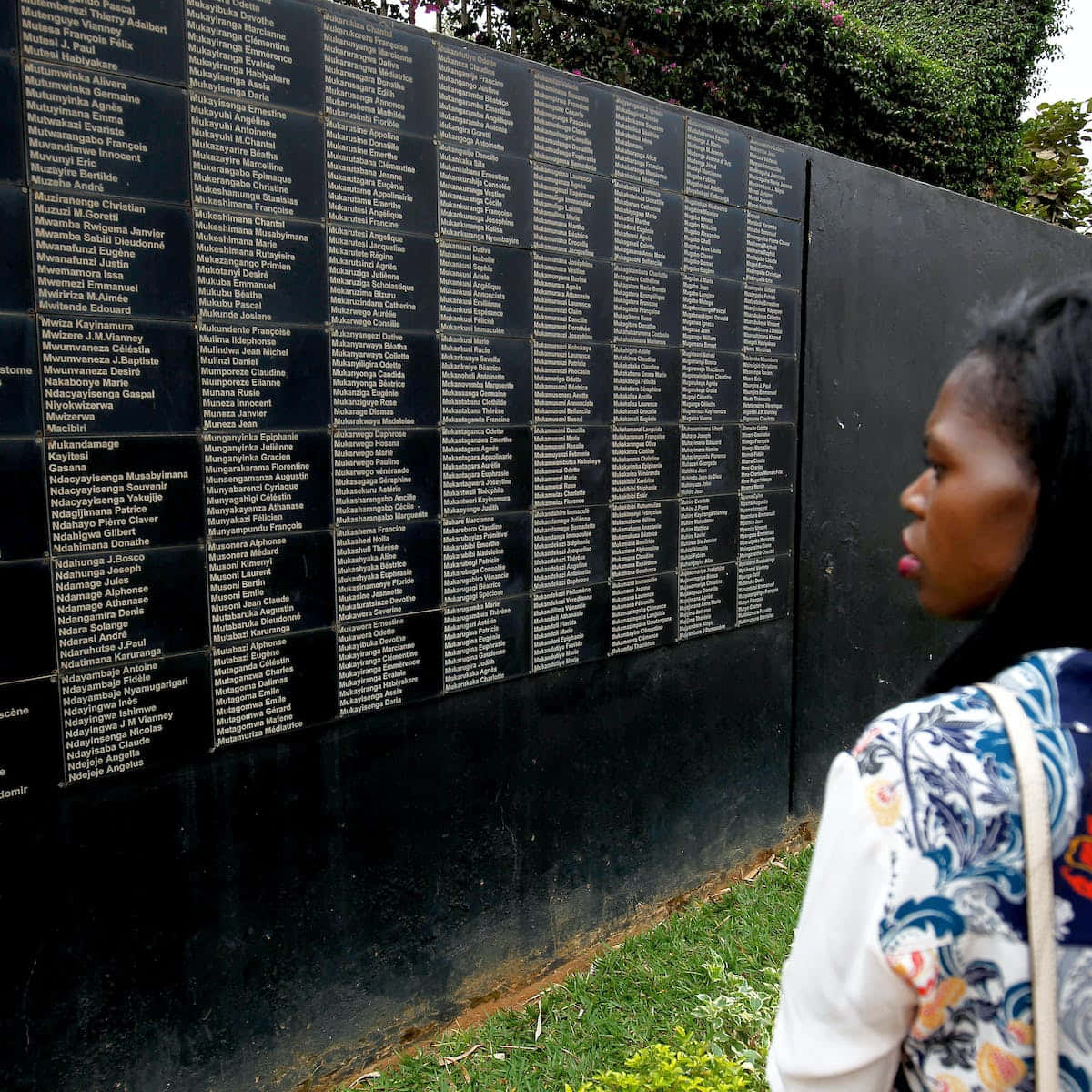 Woman At Kigali Genocide Memorial Black Wall Wallpaper