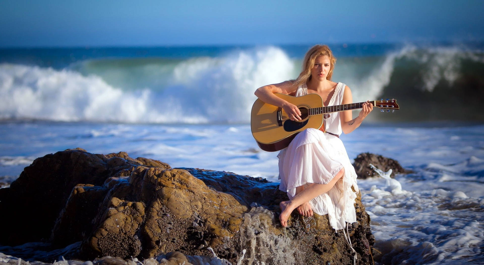 Woman Beach Playing Guitar Picture