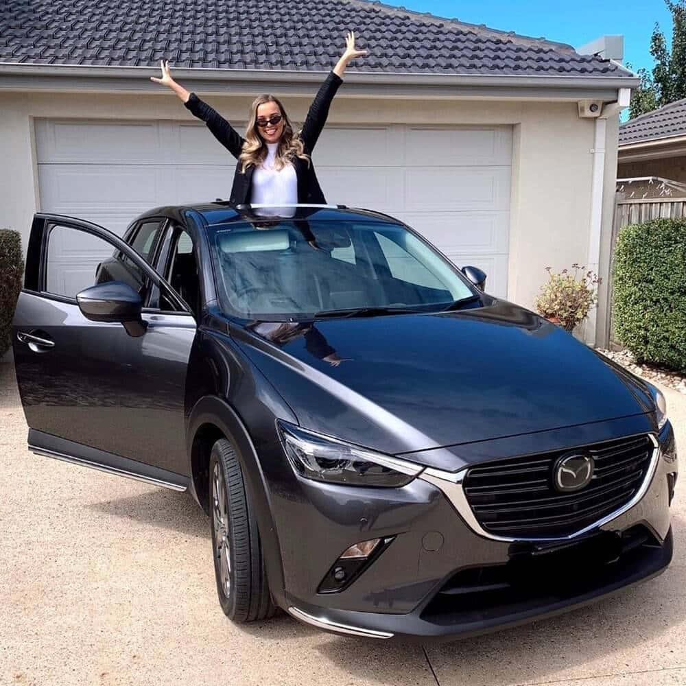 Woman Celebrating New Car Wallpaper