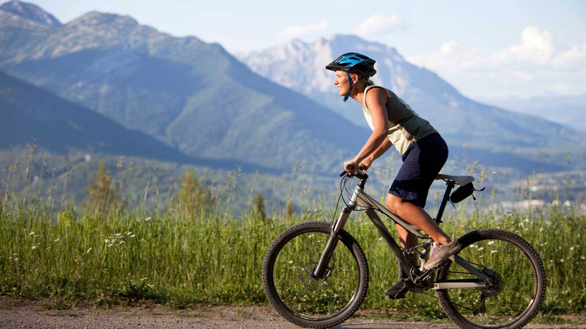 Woman Cyclist Terrain Mountain Biking Wallpaper