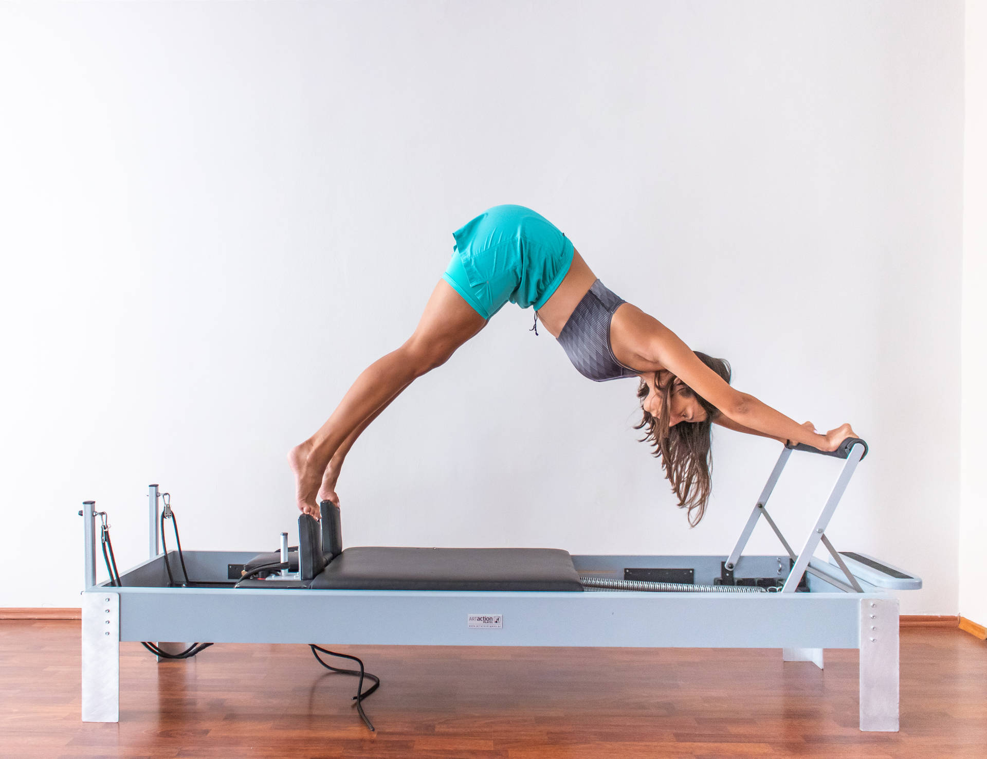 Woman Exercising Pilates Wallpaper