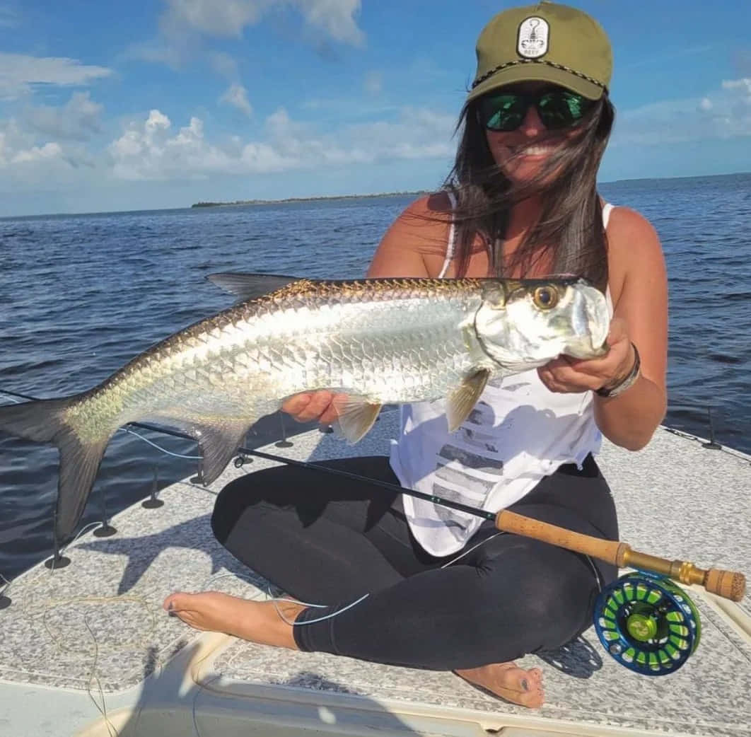 Woman Holding Caught Tarpon Fishing Trip Wallpaper