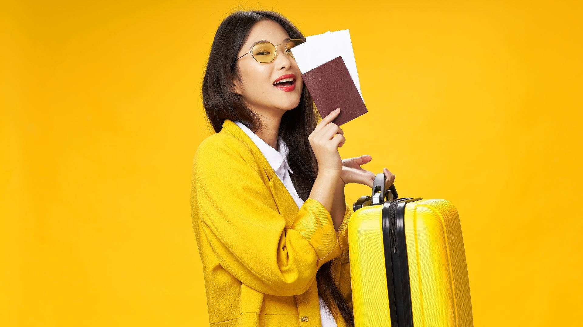 Woman Holding Passport And Yellow Suitcase Wallpaper