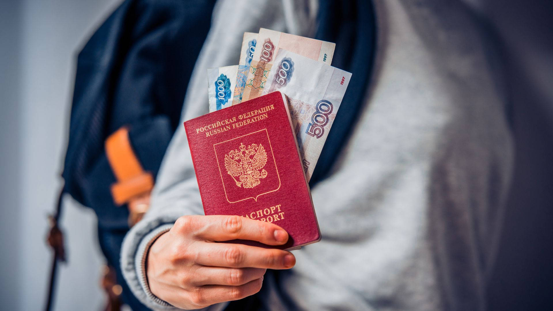Woman Holding Russian Passport And Banknote Wallpaper